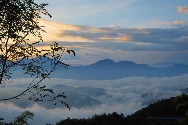 Mountain Range Above Clouds — Blue