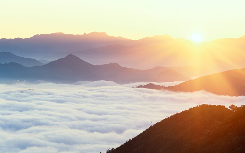 Mountain Range Above Clouds — Orange, Serene, Sunrise