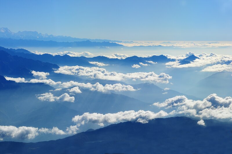 mountain range above clouds