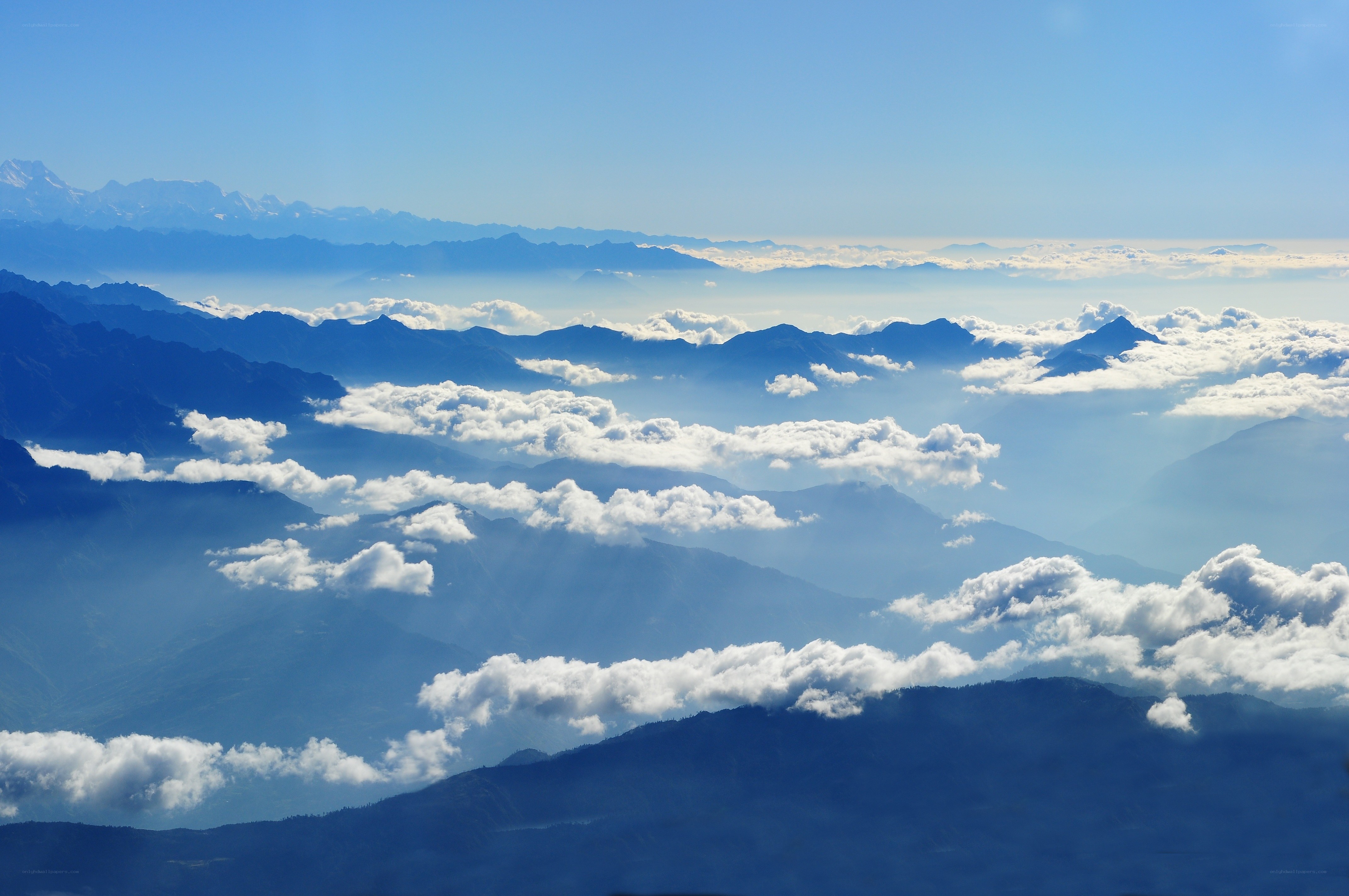 mountain range above clouds