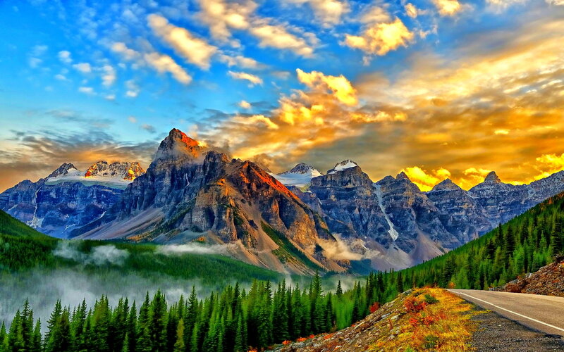 Mountain Range at Sunrise — Blue, Dramatic, Photograph, Forest, Road, Clouds