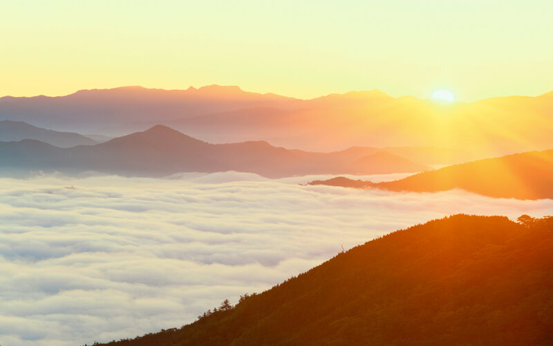 Mountain Range at Sunrise — Orange, Serene, Photograph, Sun, Clouds, Hills, Yellow, White
