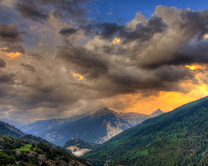 Mountain Range at Sunset — Blue, Dramatic, Photograph, Clouds, Forests