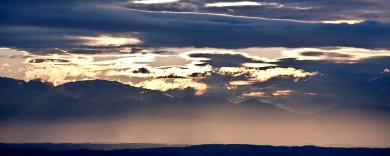 Mountain Range at Sunset — Blue, Dramatic, Photograph, Clouds, Sunlight, Haze, Gold, Black
