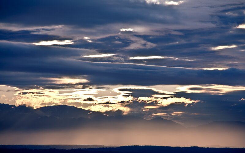 Mountain Range at Sunset — Blue, Dramatic, Photograph, Clouds, Sunlight, Haze