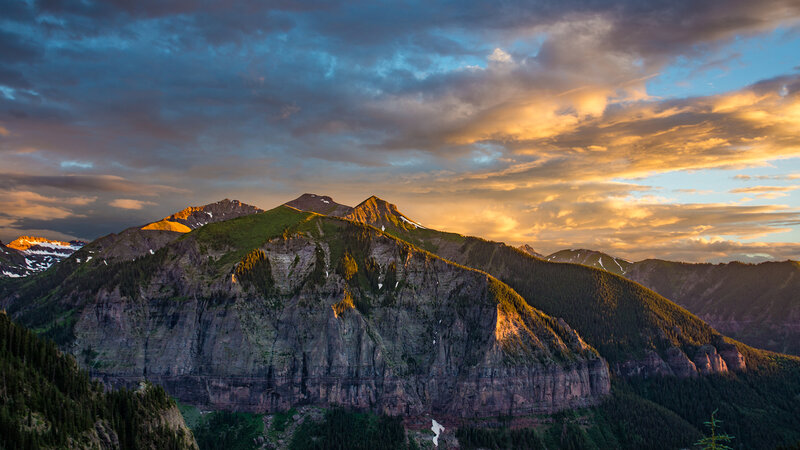 Mountain Range at Sunset — Blue, Dramatic, Photograph, Clouds, Trees