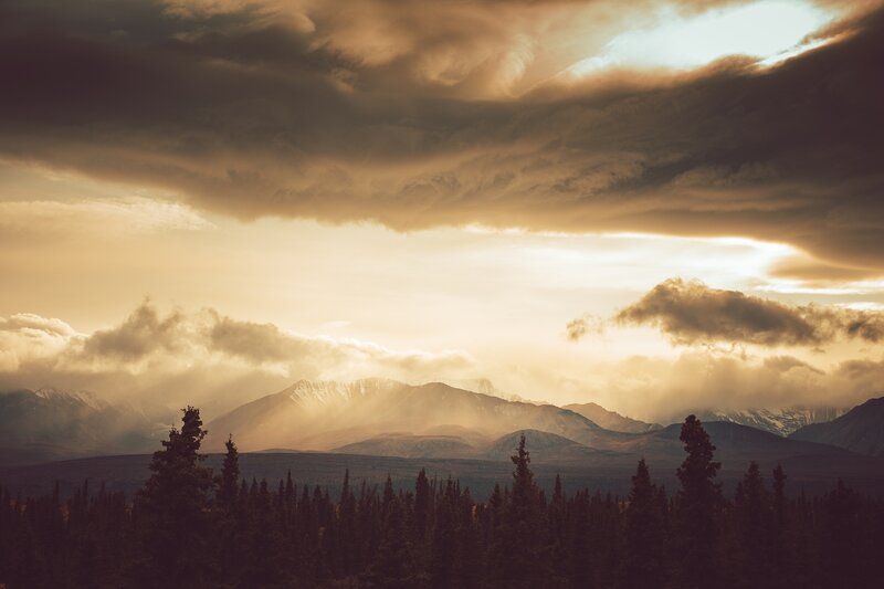 Mountain Range at Sunset — Gold, Dramatic, Photograph, Clouds, Trees, Snow