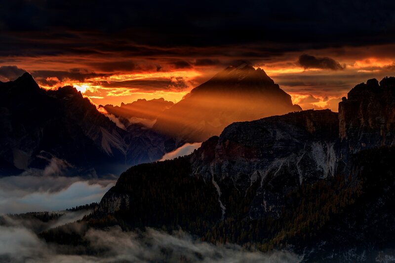 Mountain Range at Sunset — Orange, Dramatic, Photograph, Clouds, Sunlight, Forests
