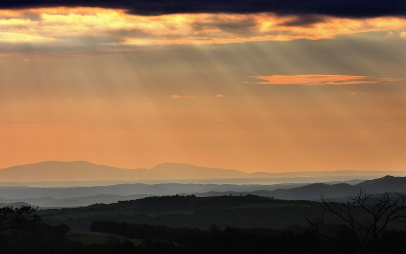 Mountain Range at Sunset — Orange, Dramatic, Photograph, Clouds, Sunlight, Hills