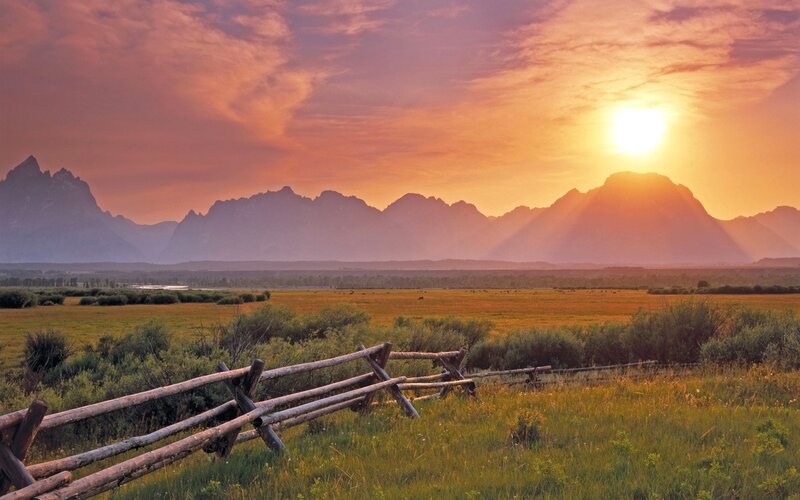 Mountain Range at Sunset — Orange, Serene, Photograph, Fence, Field, Sun