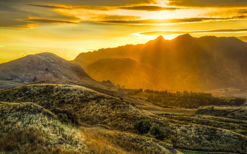 Mountain Range at Sunset — Yellow, Dramatic, Photograph, Hills, Trees, Sky