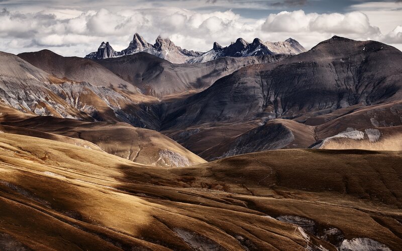 Mountain Range Landscape — Brown, Dramatic, Photograph, Clouds, Valleys