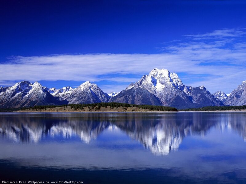 mountain range reflected in lake