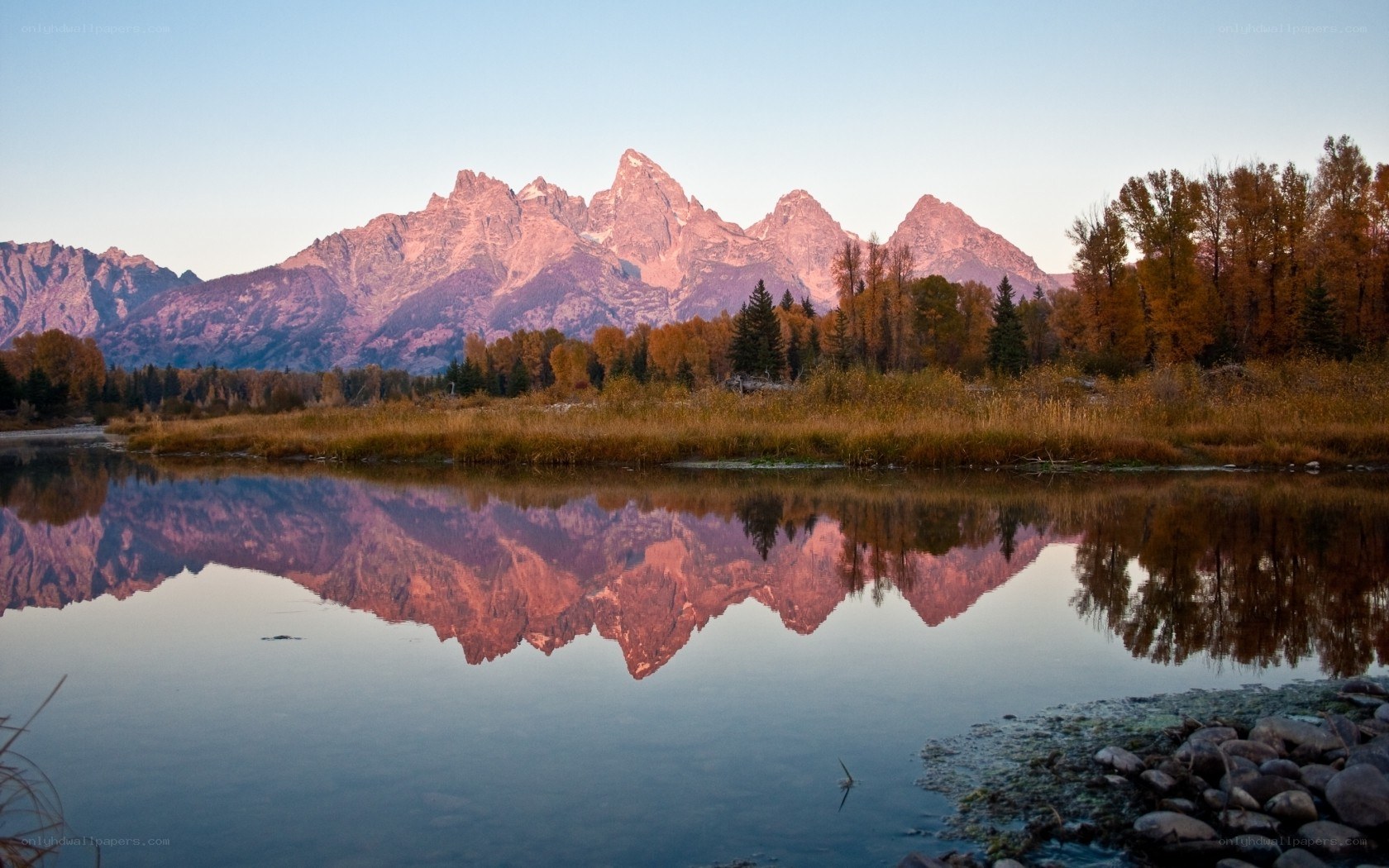 mountain range reflected in lake