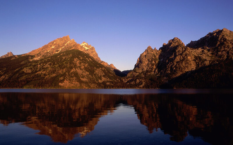 Mountain Range Reflection — Blue, Serene, Sunset, Photograph, Lake, Sky, Trees, Brown