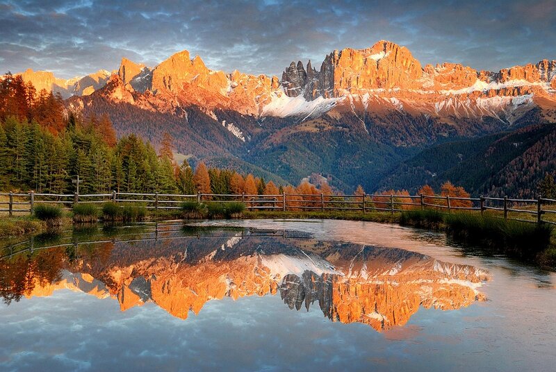 Mountain Range Reflection — Orange, Serene, Sunset, Photograph, Lake, Fence