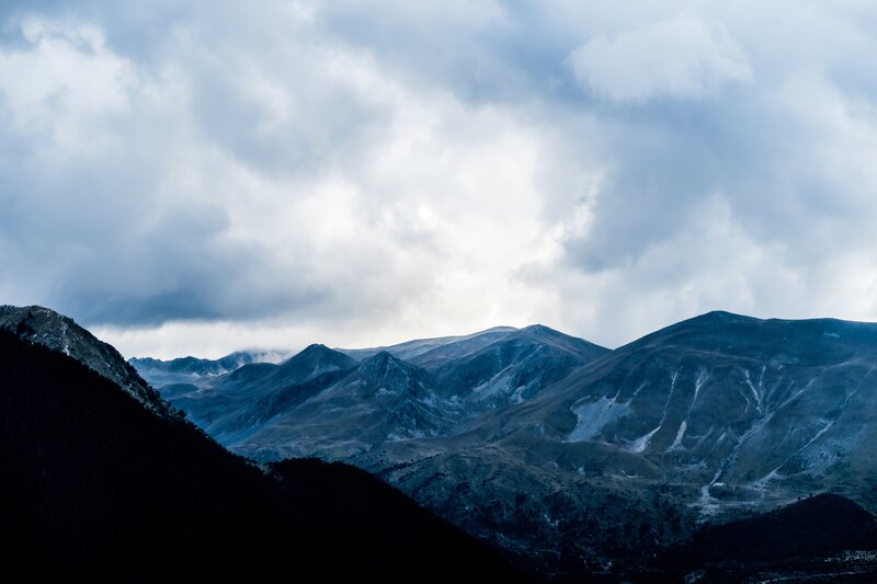 Mountain Range under Clouds — Blue, Dramatic, Photograph