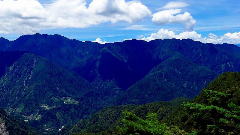 Mountain range under cloudy sky