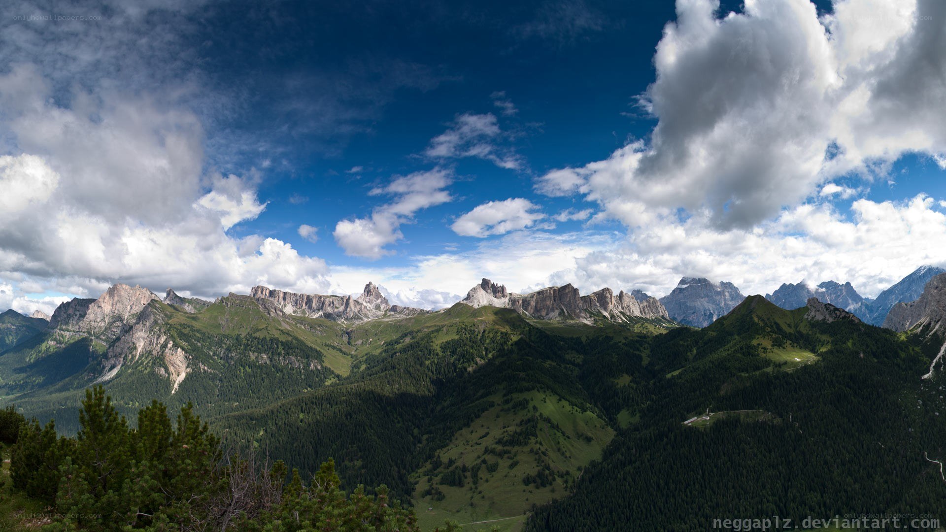 mountain range under cloudy sky