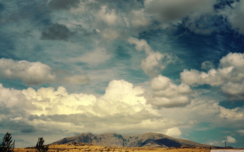 Mountain Range under Cloudy Sky — Blue, Dramatic, Afternoon, Photograph