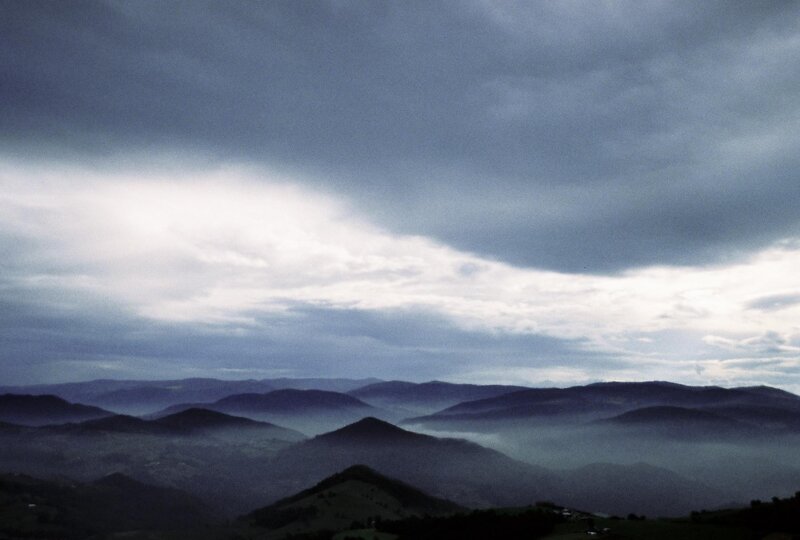 Mountain Range under Cloudy Sky — Gray, Dramatic, Photograph