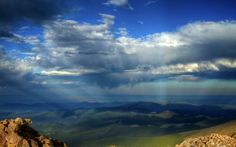 Mountain Range under Storm Clouds — Blue
