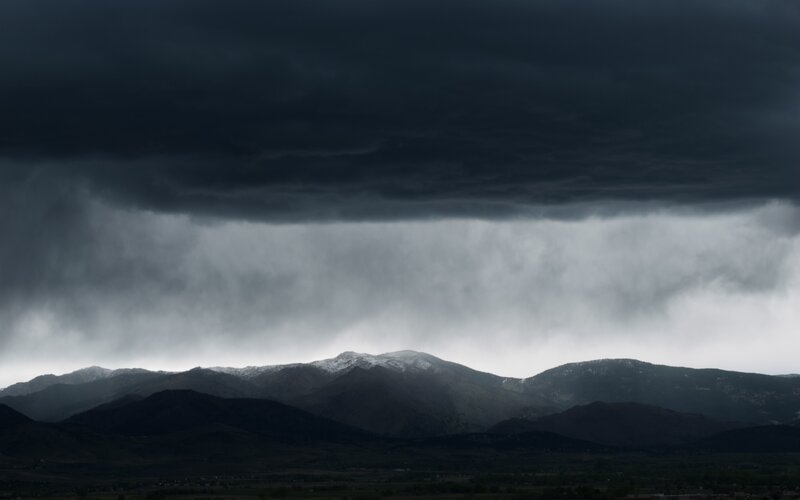 Mountain Range under Storm Clouds — Gray