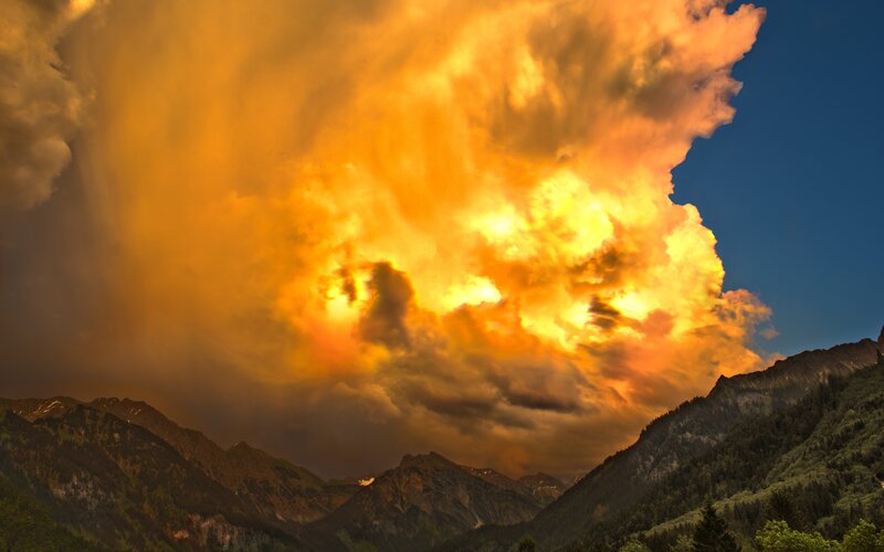 Mountain Range under Storm Clouds — Orange