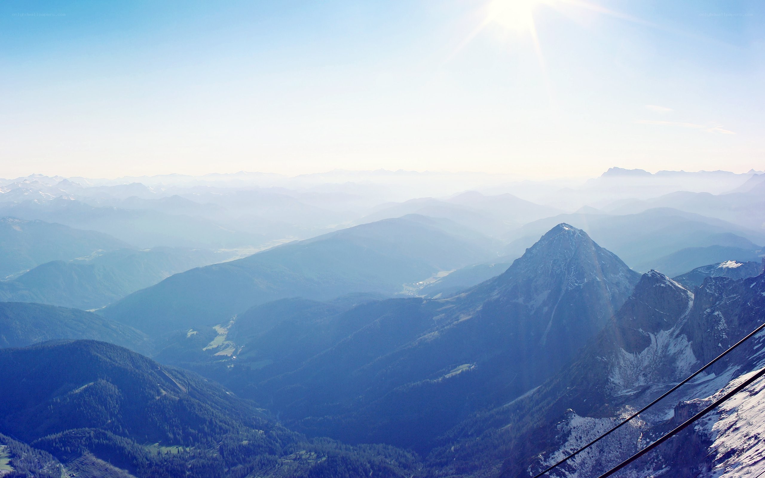 mountain range under sunny sky