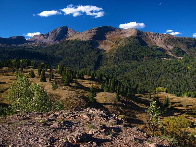 Mountain Range with Forest — Blue, Serene, Afternoon, Photograph, Trees, Rocks, Clouds