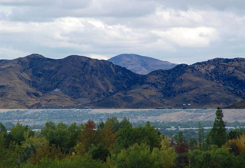 mountain range with lake and town