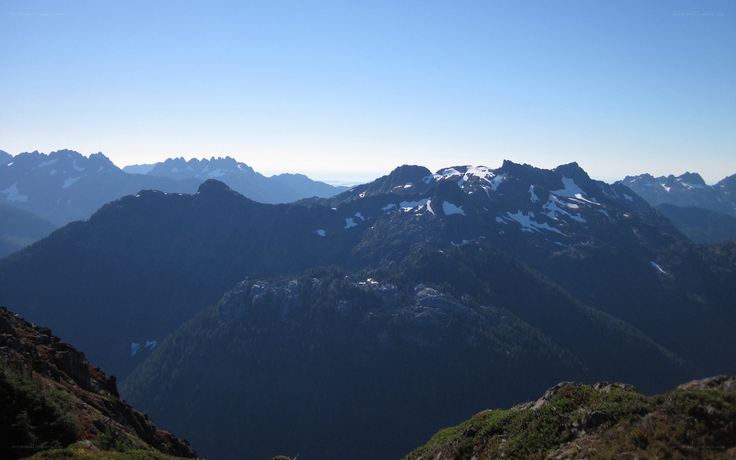 mountain range with snow patches
