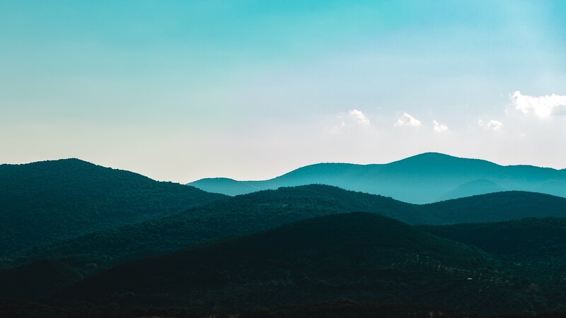 Mountain ranges under blue sky