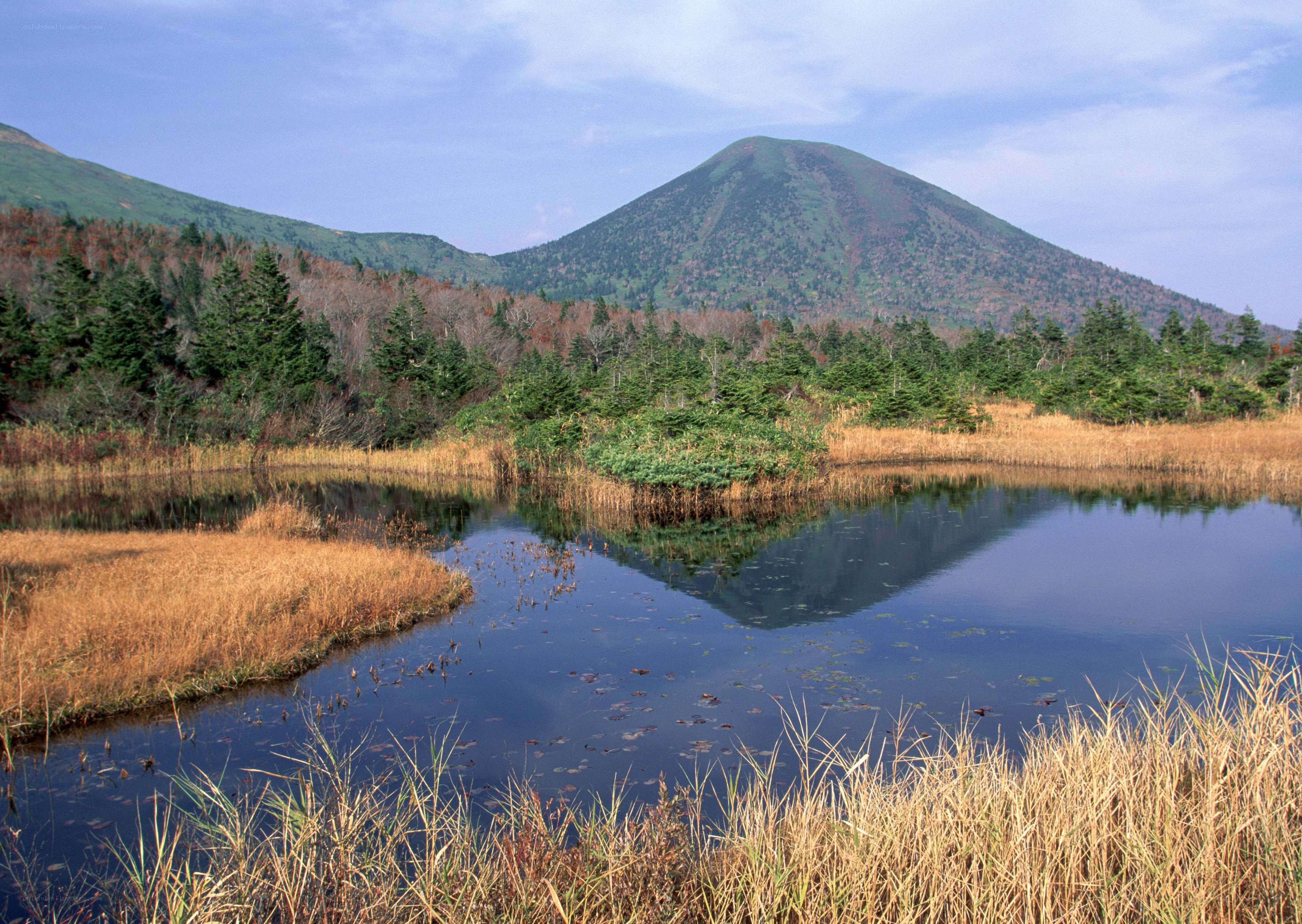 Mountain reflected in a calm pond