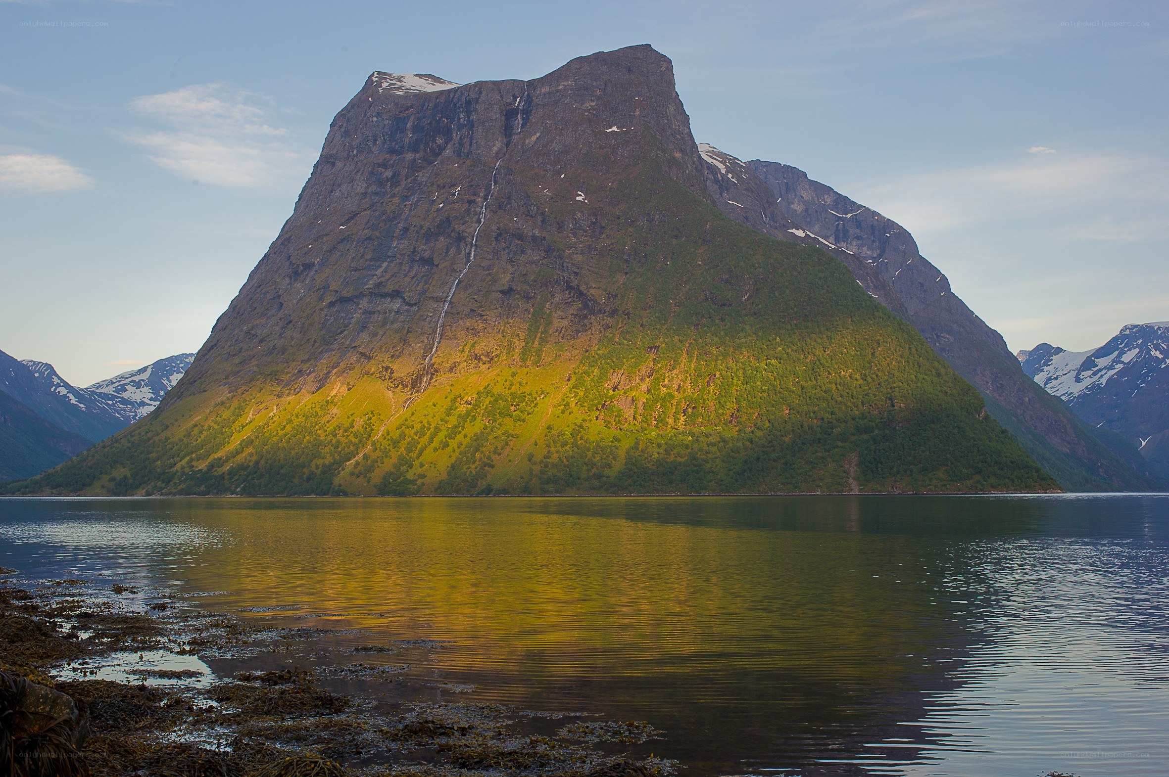 Mountain reflected in a fjord