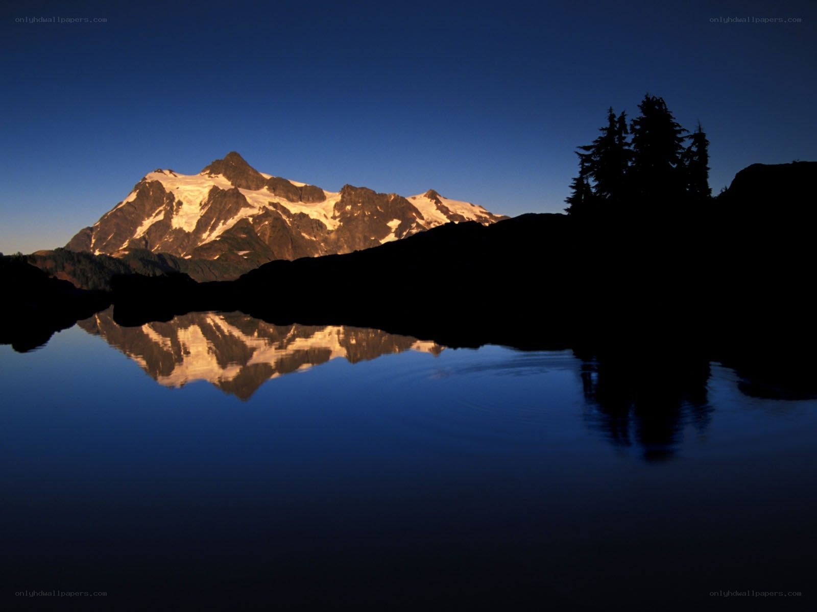 Mountain reflected in a lake at dawn
