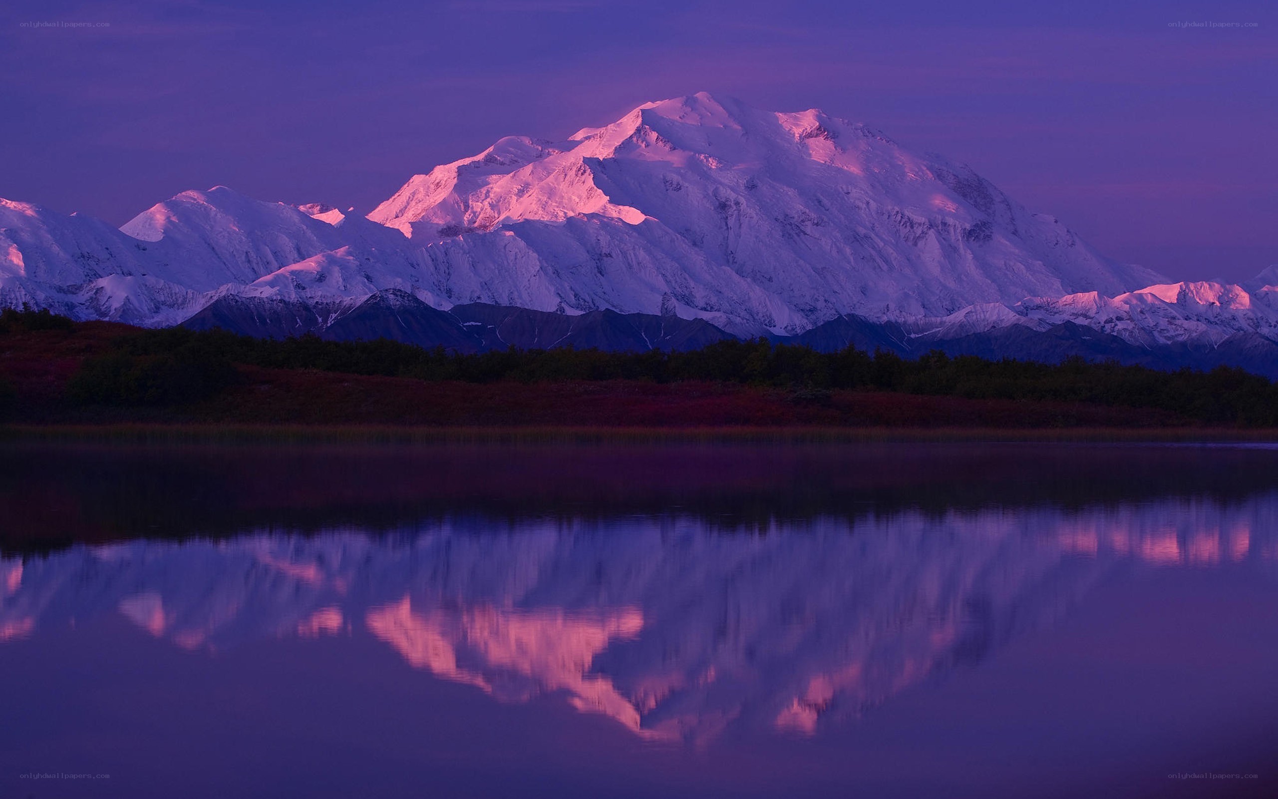 Mountain reflected in a lake at dusk