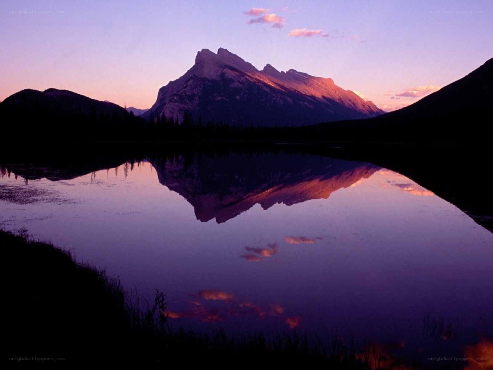 Mountain reflected in a lake at sunset