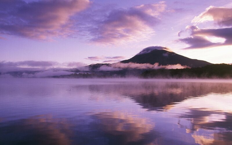 Mountain reflected in a misty lake