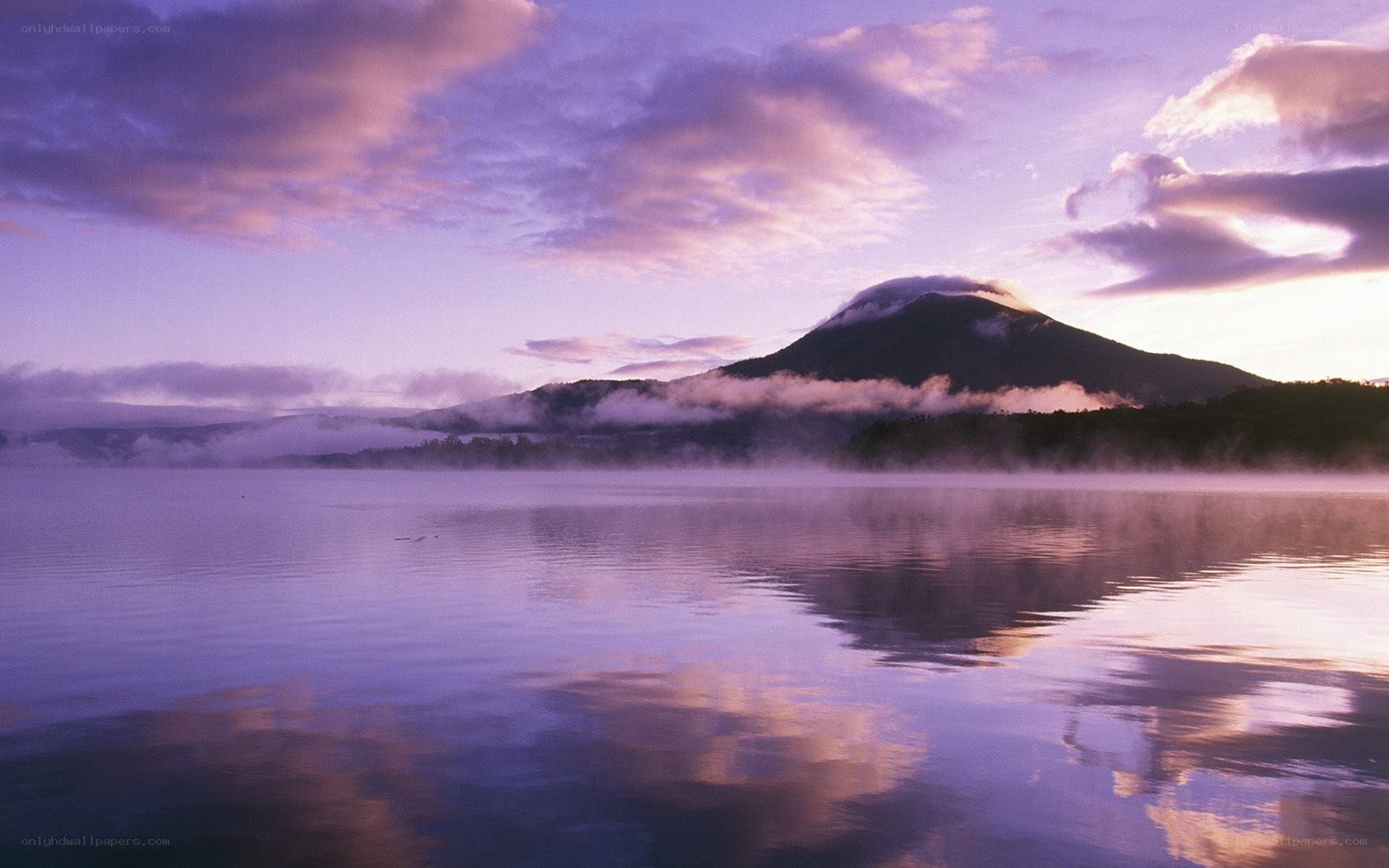 Mountain reflected in a misty lake