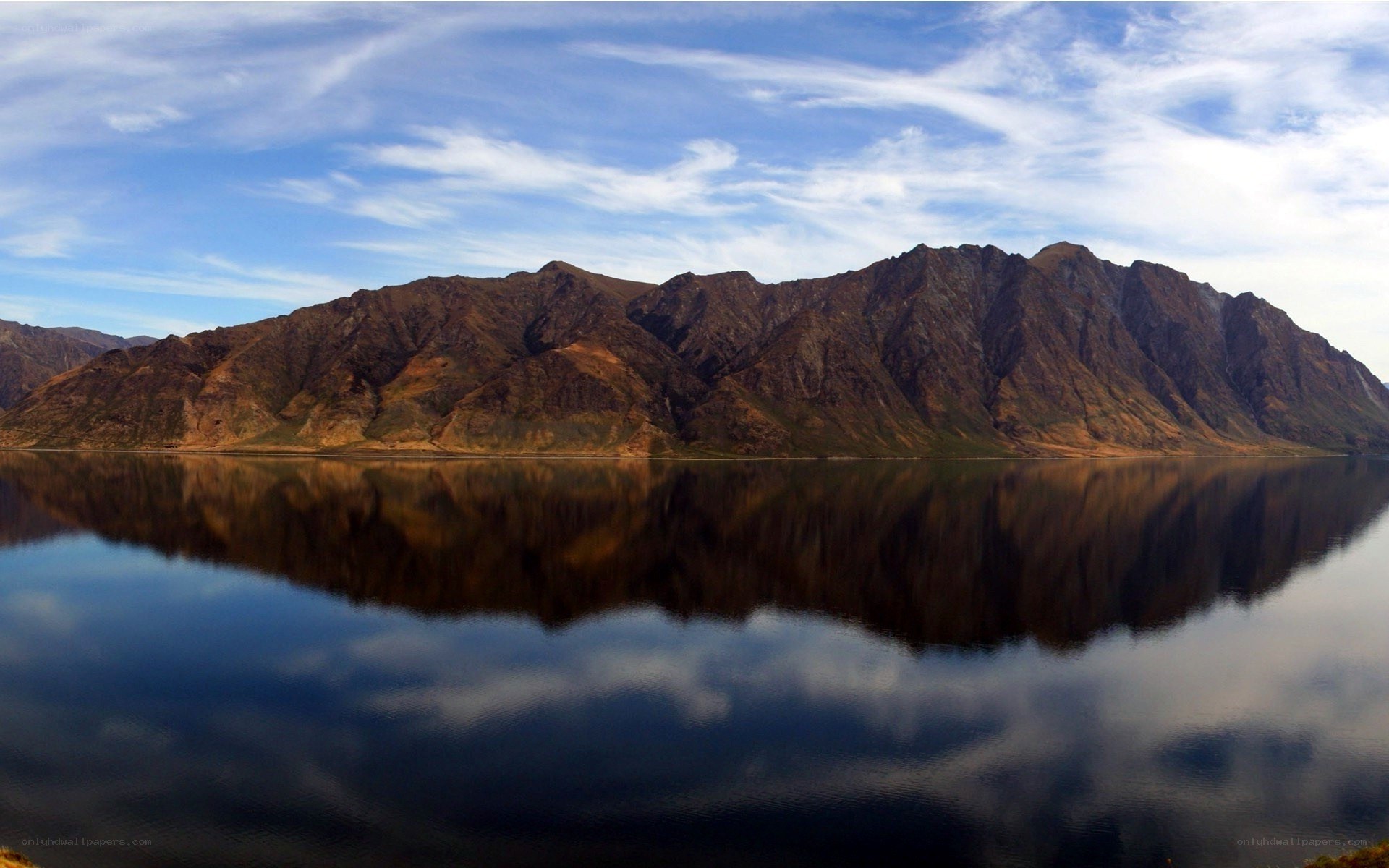 Mountain reflected in calm lake