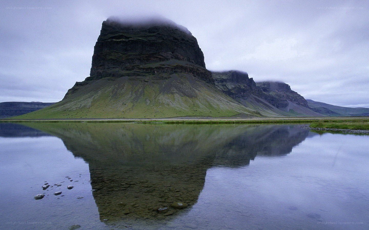 Mountain reflected in calm water