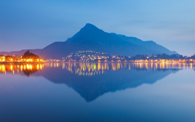 Mountain reflected in lake at dusk