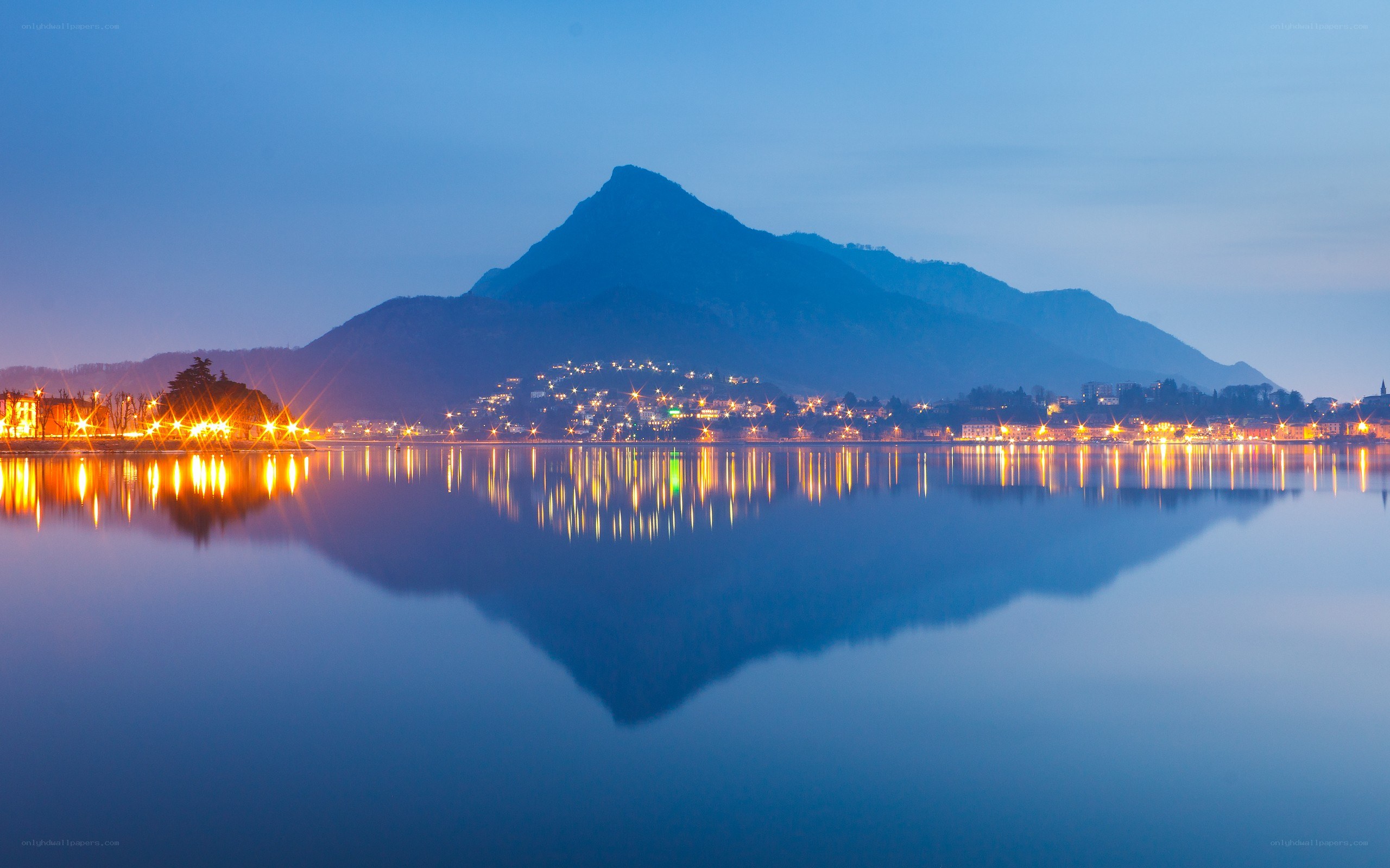 Mountain reflected in lake at dusk