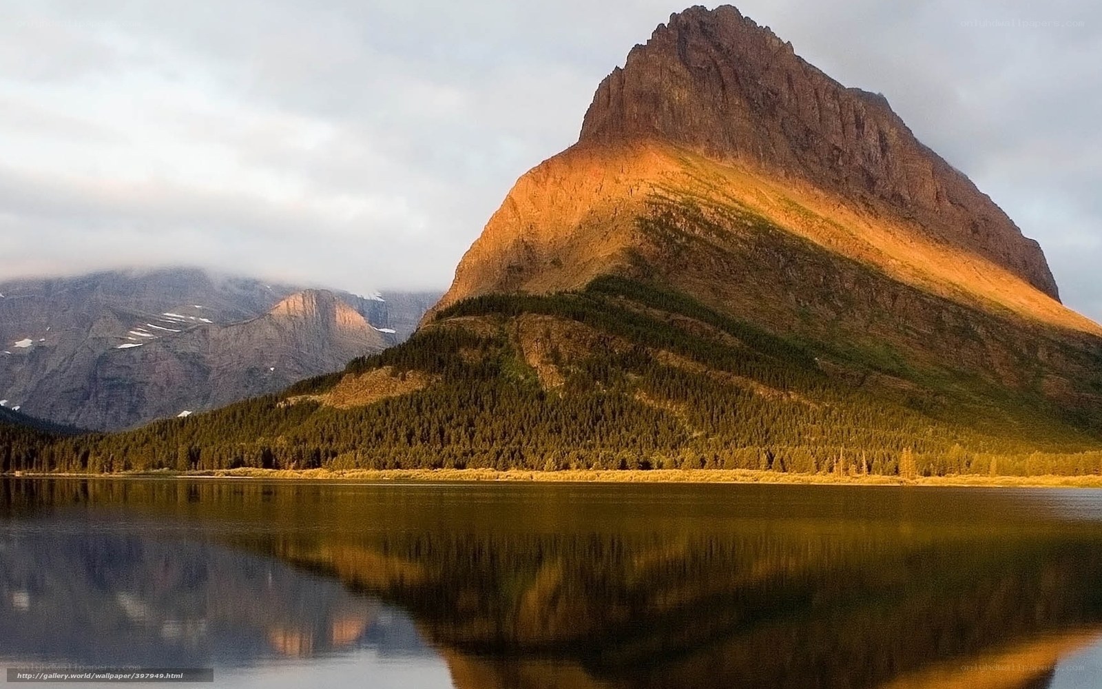 Mountain reflected in lake at sunset