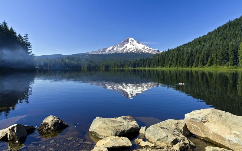 Mountain Reflected in Lake — Blue, Serene, Afternoon, Photograph, Trees, Rocks, Snow