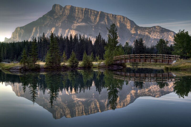 Mountain Reflected in Lake — Blue, Serene, Morning, Photograph, Bridge, Trees, Forest