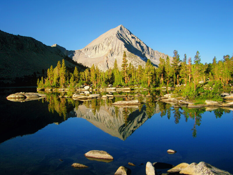 Mountain Reflected in Lake — Blue, Serene, Morning, Photograph, Trees, Rocks