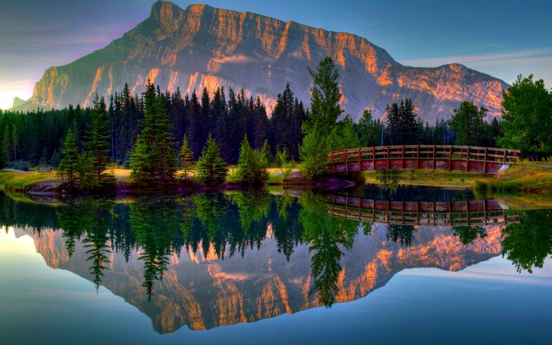 Mountain Reflected in Lake — Blue, Serene, Sunset, Photograph, Bridge