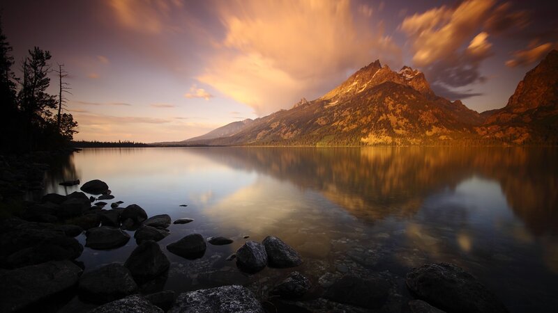Mountain Reflected in Lake — Orange, Serene, Sunset, Photograph, Rocks, Trees
